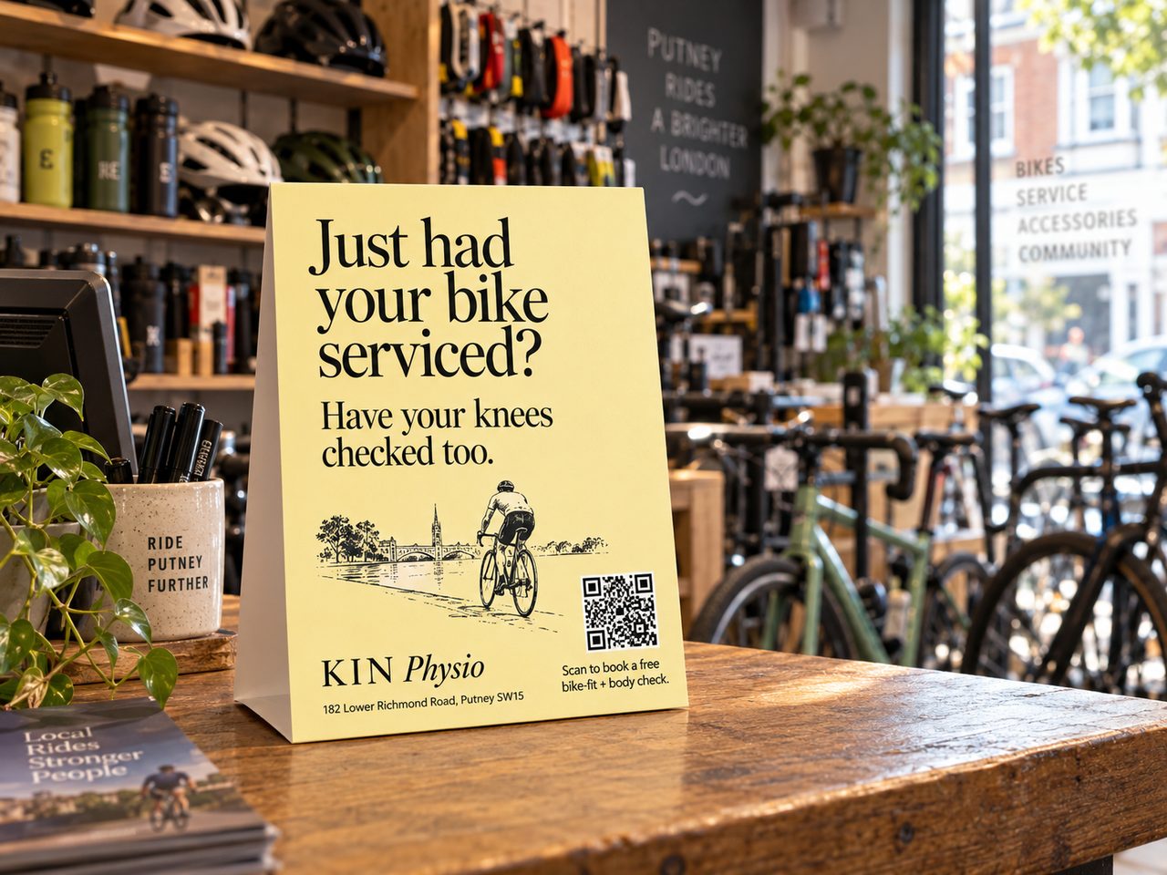 KIN Physio counter card inside a local bike shop