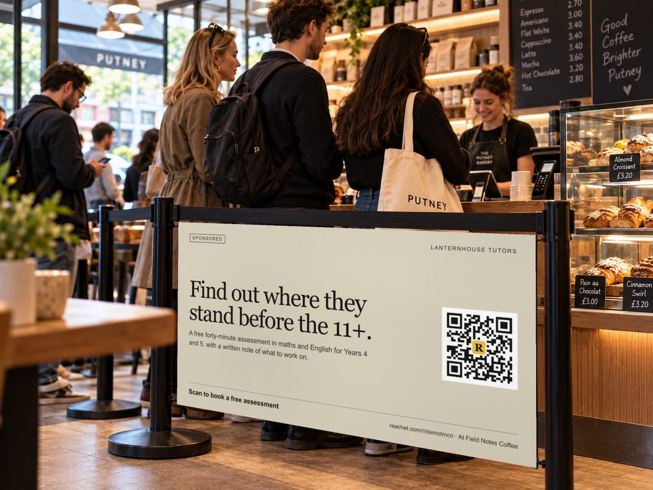 A banner on a bakery queue barrier with a tutor's offer and its QR code